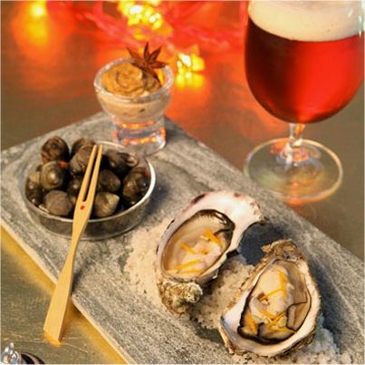 Huîtres en écume de bière, gingembre et zestes d'orange, bigorneaux à la mayonnaise de badiane